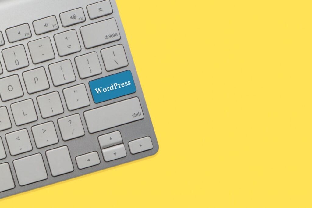 Computer keyboard with a blue WordPress key, representing moving a WordPress site to a new host